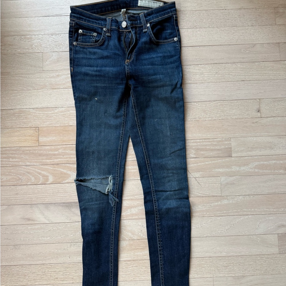 Women's Rag & Bone size 24 skinny jeans with one knee distressed.